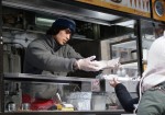 Ihityor Murodzoda, 21, of Brooklyn operates a Waffles and Dinges cart in Central Park on January 25, 2010 and claims that bad weather is bad for business. In the winter months Murdoza says the business struggles because people are not interested in eating outside. (Photo by Jessica Bell)