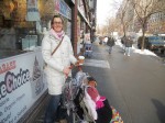 Marianne Bolhuis, 34, holding onto a warm cup of coffee, stands with her 9-month-old daughter Noelle in front of Zabar's in the Upper West Side section of New York on Tuesday, Jan 25, 2011. Many moms like Bolhuis have a tough time keeping their kids warm and making it through the snow with their strollers. Pavement Pieces / Elizabeth Vulaj