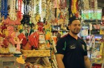 Jordan Velazquez, 20, stands behind the front counter at La Carreta Market in Detroit's Mexicantown. Velazquez said more aggressive border patrol enforcement has led to a decrease in business at the store. Photo by Kathryn Kattalia
