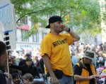 Paul Isaac, of Flatbush Brooklyn overlooks Zuccotti Park, surveying the crowd for signs of confrontation. As a member of the security force within occupy wall street, Isaac coordinates with other members via hand held radio, if incidents break out. Photo by Eric Zerkel