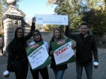Cousin Marrisa Gordon, sister Jillian Bernstein and friends Alyse Bondi and Jeremy Smilovitz hold up signs to cheer on marathon runner Jenna Bernstein. Photo by Nicole Guzzardi