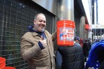 The Bucket Man Richard Sedotto sold hundreds of buckets Tuesday to Giants fans looking to get above the crowds at the Super Bowl Champion's ticker tape parade. Photo by Jamie Larson