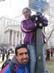 David Gomez and his daughter, 9-year-old Melinda, look on during Sunday's Giants Super Bowl parade. Photo by Louie Lazar.