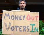 Jeffrey Brewer  34, protested outside a Republican fundraiser. "Money Out, Voters In." . By Mary Zarikos