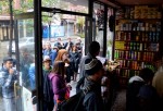 Crowds of local residents without electricity because of Hurricane Sandy, lined up to buy hot drinks and canned goods at Bleecker's Finest Deli in Greenwich Village today. Photo by Mary Zarikos.