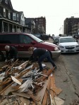 Vincent Fusco, 69, pictured left, cleaning debris from his home on Beach 119th Street. Less than 100 yards from the Atlantic Ocean, the basement had eight feet of water and the home suffered some damage to the foundation during Hurricane Sandy. Photo by Timothy Weisberg.