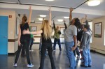 Participants in the acting class at Phoenix House Career Academy partake in a physical warm-up. Photo courtesy of Tommy Demenkoff.