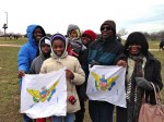 Four generations of the  Lettsome family holds up the flag of the US Virgin Islands at the 2013 Inauguration.
Photo by Breana Jones