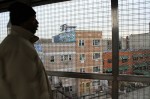 Alex Johnson, who has lived in Bushwick, Brooklyn for ten years, points out new housing near the Kosciusko train stop. Photo by Gabrielle A. Wright.
