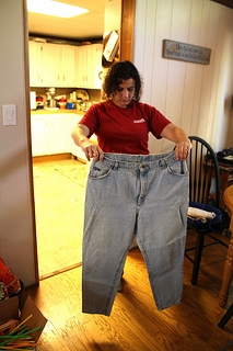 Ann Couch, 47, of Birmingham, Ala. holds up a pair of her size 26 pants from before her gastirc bypass surgery in 2003. Photo by Zoe Lake.
