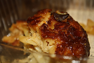 Noodle Pudding, or kugel, is a Jewish baked casserole made with egg noodles or potatoes, in both sweet and savory varieties. The JCC's noodle pudding was sweetened with apples and raisins. Photo by Jordyn Taylor.