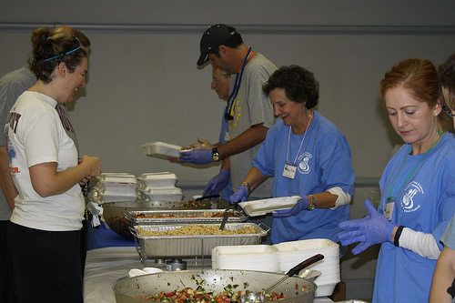 Amy Saag, 57 (second from right) serves up cabbage rolls and couscous to a guest at the Birmingham JCC's Jewish Food Festival on Oct. 27th. Photo by Jordyn Taylor.