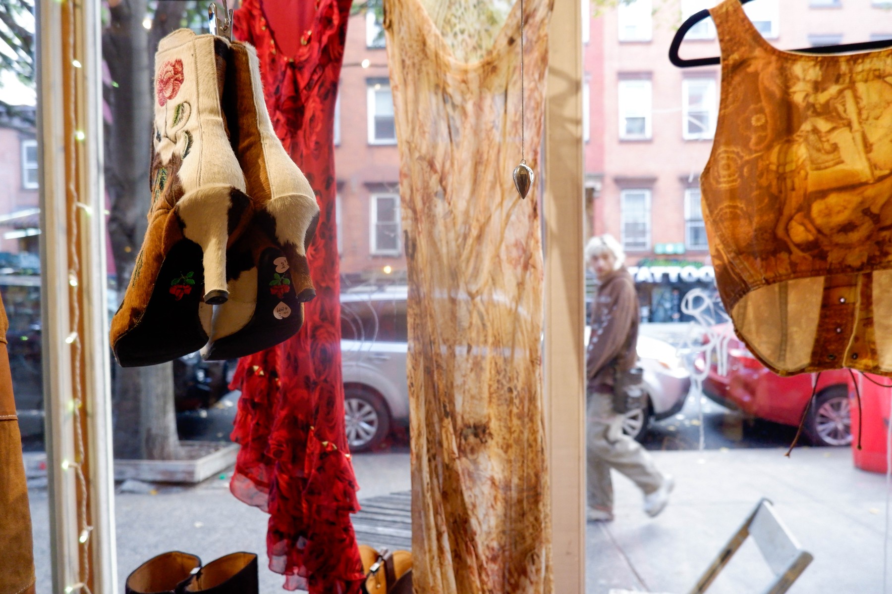 Two windows are filled with unique vintage – not thrift – pieces, inviting passersby to slow down and stroll through.
