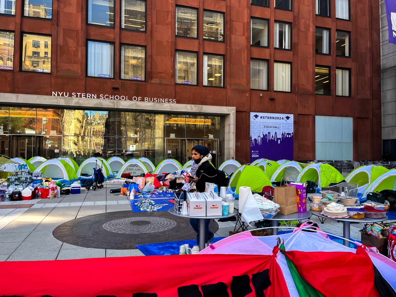 Several dozen NYU students occupied Gould Plaza on Monday, in front of the NYU Stern School of Business, in protest of the continued war in Gaza and NYU's connections with Israel. (Photography by Ryan Schwach)