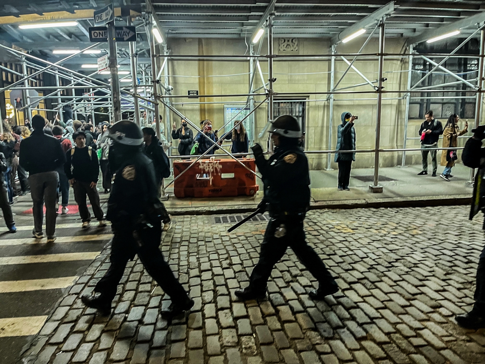 By 8:30 p.m., NYPD officers moved in the back of Gould Plaza via West 3rd Street, and announced over a loudspeaker that if protestors did not leave the plaza they would be arrested for trespassing. (Photography by Ryan Schwach)