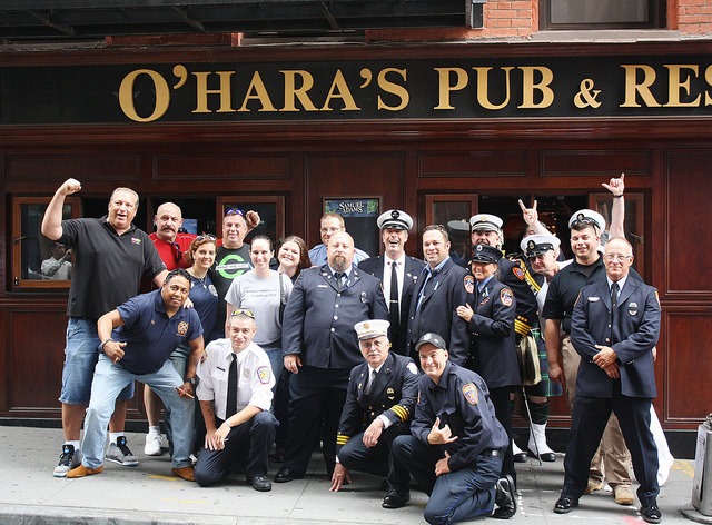 9/11 first responders gather for a group photo at their yearly meeting spot, O'Hara's Pub, NYC. Photo by Thom Friend.